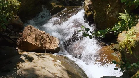 Mountain stream waterfall rushing over rocks 스톡 동영상 342340344
