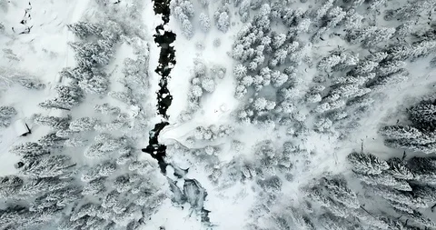 Mountain stream with a waterfall in winter birds eye aerial view Stock Footage 102778601