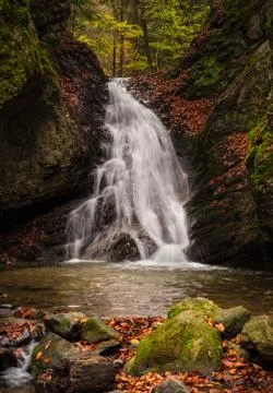 Mountain stream with waterfalls Stock Photos