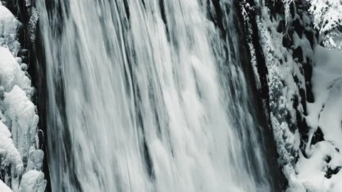 Mountain stream in the winter. Mountain Waterfall. Video stock 232344360