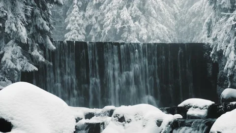 Mountain stream in the winter. Mountain Waterfall. Video stock 232344459