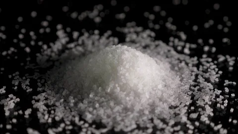 Mountain of sugar is rotating on the table Stock Footage 86285033