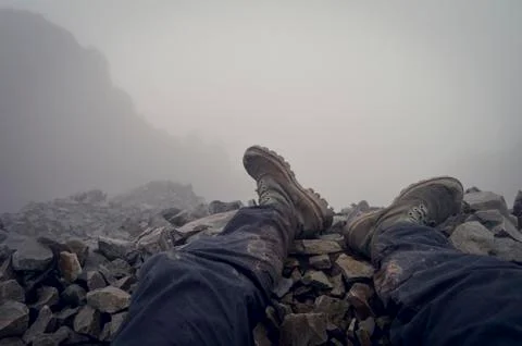 Mountain summit with boots Foto stock