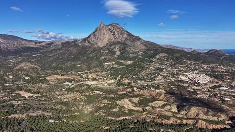 Mountain summit view, Sunlit valley from mountain top, Drone captures rocky.. Stock Photos