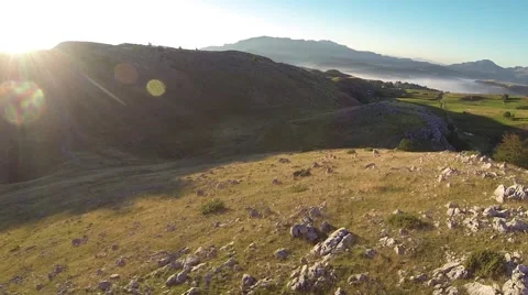 Mountain , sun and the mist low aerial 動画素材 56946978