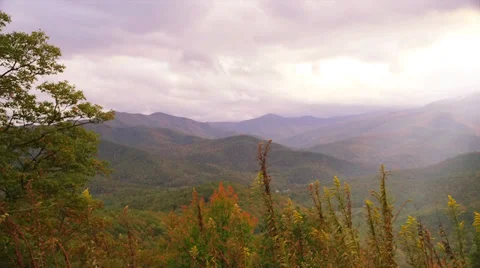 Mountain sun rays - left to right pan Stock-Footage 32074504