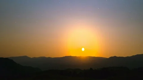 The mountain sunrise on the starry sky background. time lapse Stock Footage 80426481
