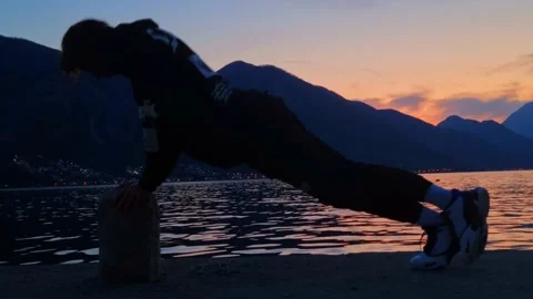 Mountain Sunset Beach Workout: Pushing Limits Stock Footage 237998088