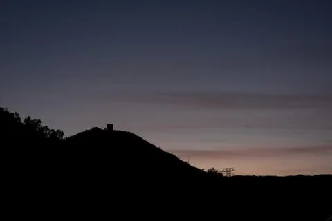 Mountain at Sunset with Building Stock Photos