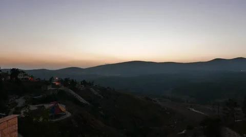 Mountain Sunset With Car Lights in Distant Hills Stock Footage 56634421