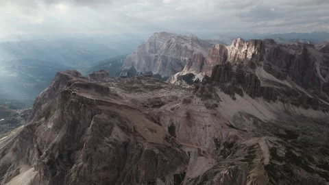 Mountain sunset light rays beaming through clouds 4K Stock Footage 221349707