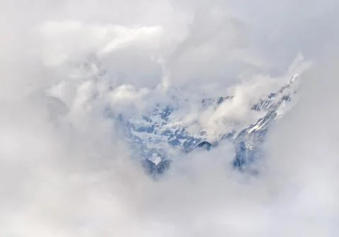 Mountain surrounded by clouds. Mount Cloudy Landscape in Himalaya Stock Photos