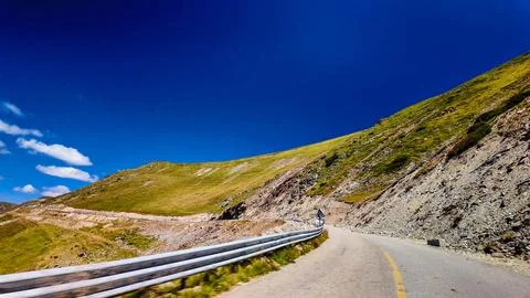 Mountain Switchback Road under Deep Blue Sky Stock Photos