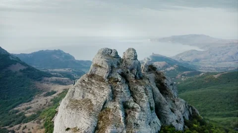 Mountain system on the sea coast. The top of the mountain. Go around in a circle Stock Footage 217406349