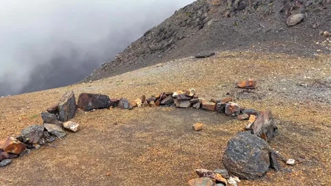 Mountain tent site prepared in wide view on a rocky alpine slope in Svaneti Stock Footage 343769573