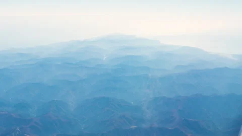 Mountain terrain view from a plane window, Japan Stock Footage 296873782