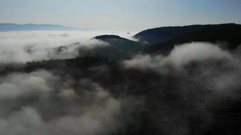 Mountain through the fog Stock Footage 128904341