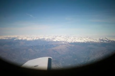 Mountain through a plane window 库存照片
