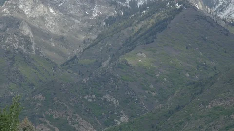 Mountain tilt down to road SLC Stock Footage 89854427