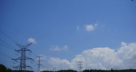 Mountain time lapse between high power line. Vídeos de archivo 92637628