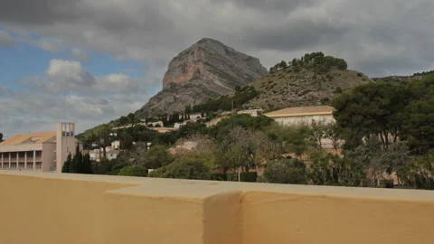 Mountain Time-Lapse on cloudy day with dolly motion - Fast camera motion Stock Footage 143894116