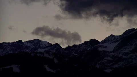 Mountain Time Lapse Featuring Dark Storm Clouds Moving over Snowy Peaks Vídeos de archivo 331166444