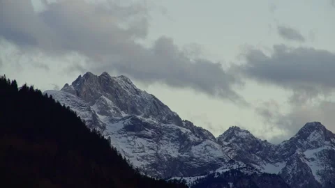 Mountain Time Lapse Showing Moving Clouds over Snowy Alpine Peaks Stockbeeldmateriaal 331166442