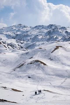 Mountain top covered by a thick layer of snow Stock Photos