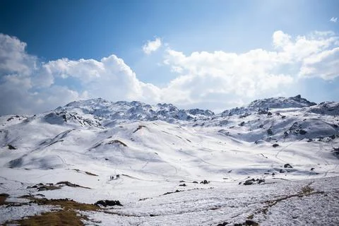 Mountain top covered by a thick layer of snow Stock Photos
