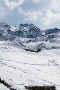 Mountain top covered by a thick layer of snow Stock Photos