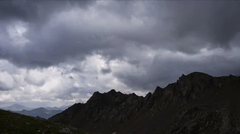 Mountain top with dramatic clouds Stock Footage 68348460