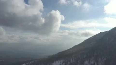 Mountain top in the mist and clouds before sunset 4K aerial video Stock Footage 102778294