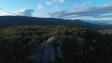 Mountain Top over Forest and Beautiful Clouds - Drone 4K Aerial Footage Vídeo Stock 132987520
