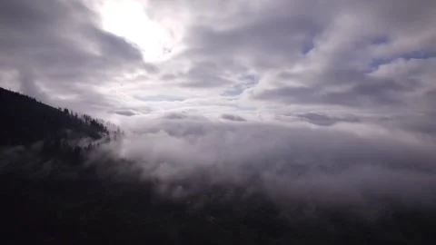 Mountain top shrouded in clouds Stock Footage 253831893