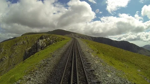Mountain top timelapse with clouds rushing by and mountain railway. Stock-Footage 90103799