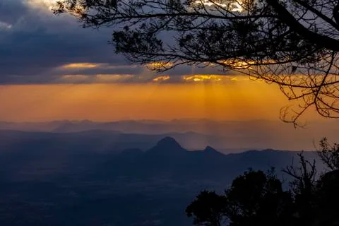 Mountain top view of distant hills at golden hour Stock Photos