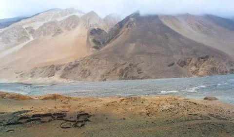 Mountain tops, covered with clouds and fog on the Chang La Pass Stock Photos