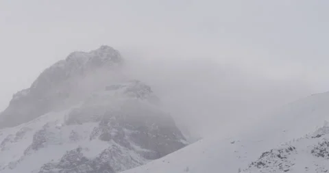 Mountain tops at winter with clouds moving by quickly Stock Footage 150491224