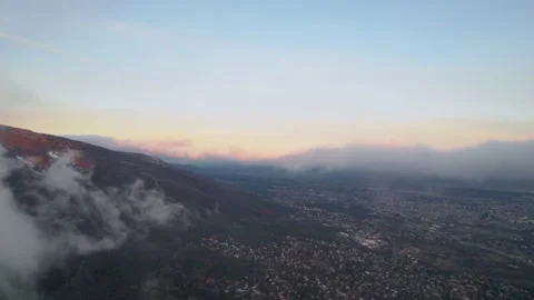 Mountain Tower City Sunrise Clouds Forward Stock Footage 201738865