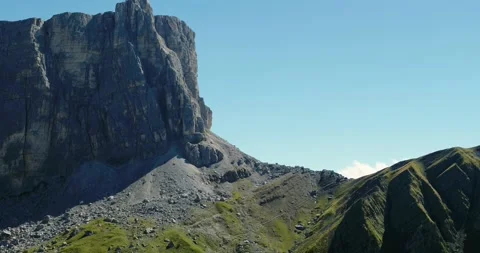 Mountain towering over deep Valley in the Alps. Aerial Landscape during Summer Stock Footage 149387236