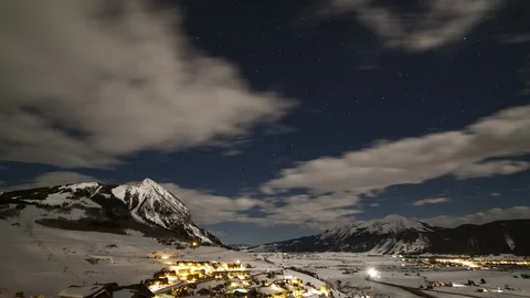 Mountain town moonlight timelapse 4KUHD 24p Stock Footage 127639561