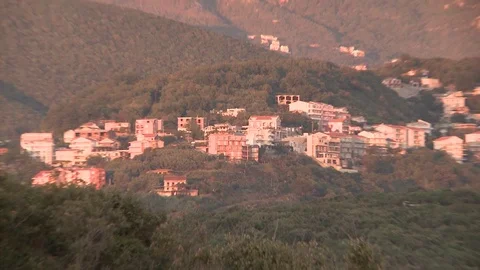 Mountain town in red colour sunset , near the sea 스톡 동영상 84316048