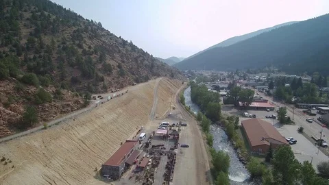 Mountain Town River Pan Right Stock Footage 84956944
