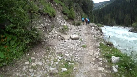 Mountain trail along the river Stock Footage 80775792