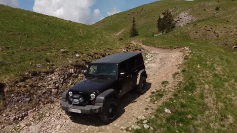 Mountain Trail Explorer: SUV Adventure in Rugged Terrains Stock Footage 254432495