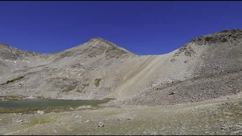 Mountain Trail FPV Pursuit: Technical Ridge Run with Canyon River Reveal Stock Footage 331896922