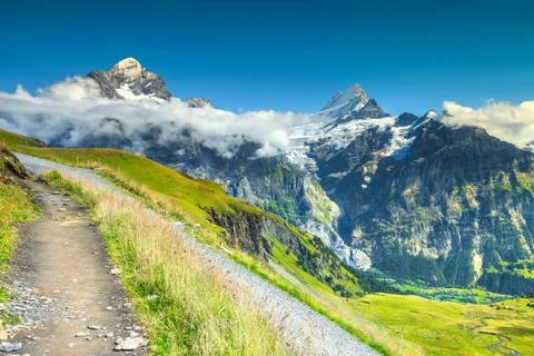 Mountain trail with high mountains in background, Grindelwald, Switzerland, E Stock Photos