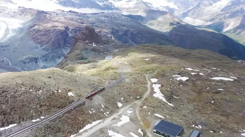 Mountain train on a beautiful landscape on the Alps Stock Footage 321462529