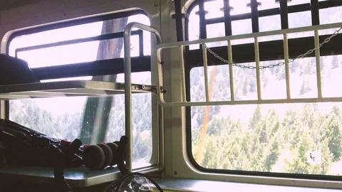 Mountain train climbing while the alpine  landscape passes away Video stock 103367740