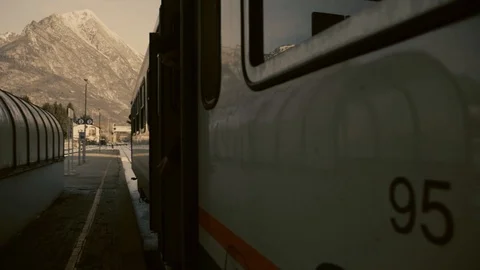 Mountain train departing on the snow Stock Footage 92369896